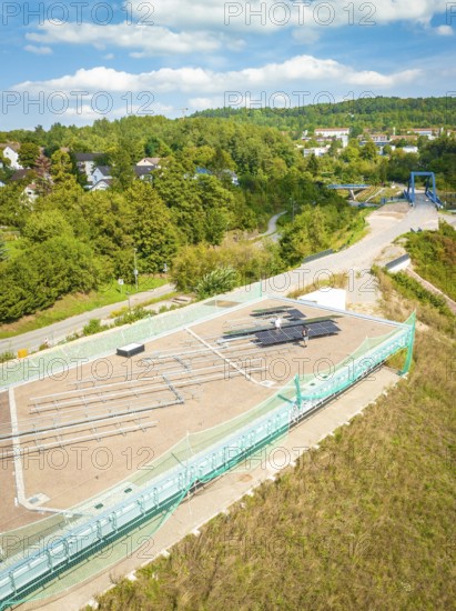 Aerial view of a construction site with solar system and surrounding green landscape in the background, new park and ride parking garage Calw Heumaden on the new Hermann Hessebahn, Calw, Germany
