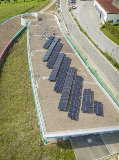 Large solar panels on roof in urban industrial park, new park and ride parking garage Calw Heumaden on the new Hermann Hessebahn, Calw, Germany