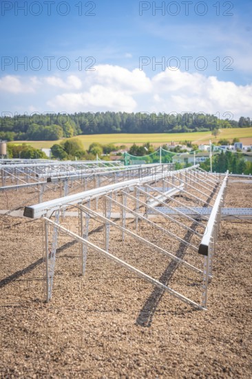 Metal structures for solar panels in an open field under a blue sky, new park and ride car park Calw Heumaden on the new Hermann Hessebahn, Calw, Germany