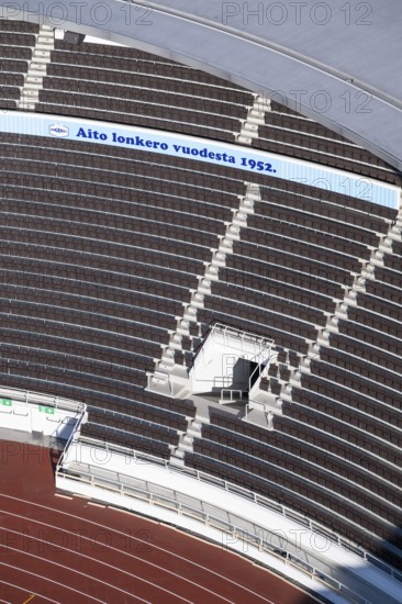 Modern stadium stand with empty seats, outdoor stairs and tartan track, Helsinki Olympic Stadium, architects Yrjö Lindegren and Toivo Jäntti, Helsinki, Finland