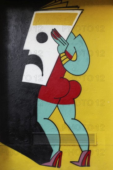 Stylized female figure holding mask in front of her face, colored mural by street art artist Mina Mania, Cubus Kunsthalle, Immanuel-Kant-Park, Duisburg, North Rhine-Westphalia, Germany