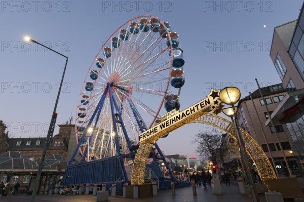 Duisburg Christmas market, illuminated entrance portal with Ferris wheel, twilight, Duisburg, North Rhine-Westphalia, Germany