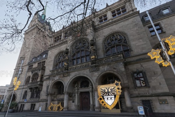 Duisburg town hall in early Renaissance style, entrance portal with Christmas decoration and city coat of arms, twilight, Duisburg, North Rhine-Westphalia, Germany