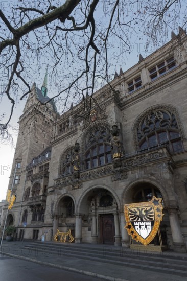 Duisburg town hall in early Renaissance style, entrance portal with Christmas decoration and city coat of arms, twilight, Duisburg, North Rhine-Westphalia, Germany