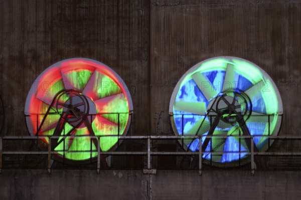 Two colour-illuminated fans at the cooling plant of the former steelworks, Landschaftspark Duisburg-Nord, Duisburg, Germany, North Rhine-Westphalia, Germany