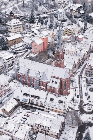 Snowy city view with dominant church in the center, Calw, Black Forest, Germany