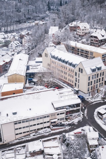 Snowy city view with modern and traditional houses in winter, Calw, Black Forest, Germany