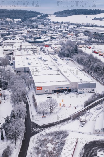 Snowy industrial view surrounded by trees and roads, in a winter landscape, Calw, Black Forest, Germany