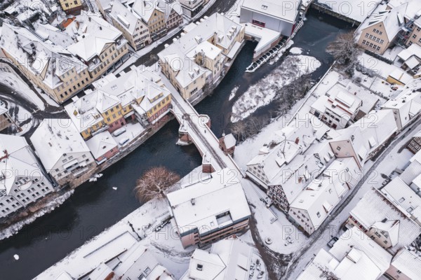 Bird's eye view of a snowy town with river and bridge, Calw, Black Forest, Germany