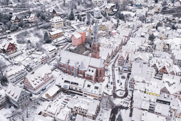 Aerial view of snowy town with large church, Calw, Black Forest, Germany