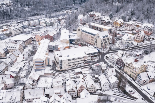 A snowy district with closely located buildings and roads, Calw, Black Forest, Germany
