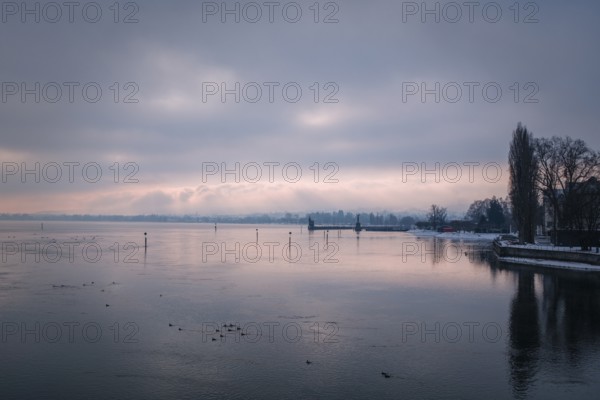 View from the old Rhine bridge across the Seerhein to the harbor entrance with the Imperia statue and the old water level tower, black and white photograph, district of Konstanz, Baden-Württemberg, Germany