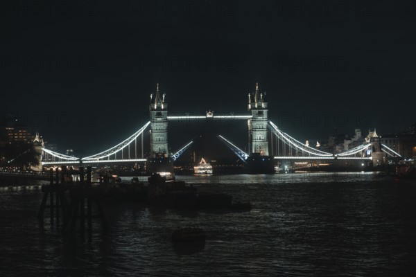 Iconic Tower Bridge, elegantly lit over water, London, England, Great Britain
