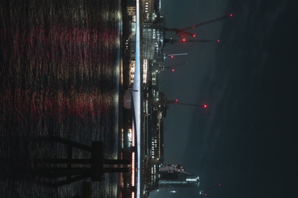 Nocturnal scene with illuminated river and bridge in the background, London, England, Great Britain