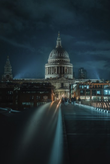 St Paul Cathedral with illuminated bridge in the foreground and urban night atmosphere, London, England, Great Britain