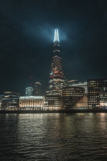 The illuminated Shard skyscraper at night in London, London, England, Great Britain