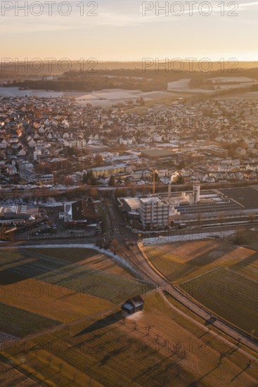 Overview of a town with fields and vast landscapes at sunset, Althengstett, Calw district, Germany