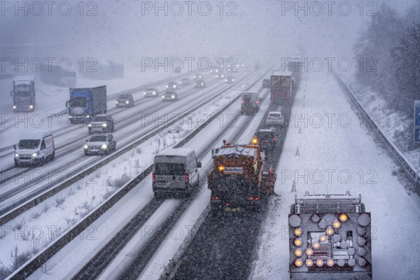 The onset of winter in North Rhine-Westphalia, heavy snowfall, A3 motorway near Hilden, near Ohligser Heide rest area, snow-covered roads, winter service of the motorway maintenance department with stray and clearing vehicles, traffic is sometimes only stalled, North Rhine-Westphalia, Germany