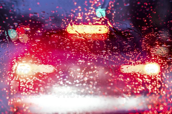 Driving in winter, in snow, rain, rear lights, brake lights