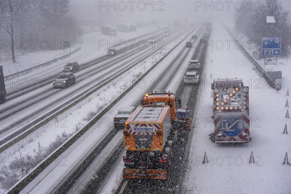 The onset of winter in North Rhine-Westphalia, heavy snowfall, A3 motorway near Hilden, near Ohligser Heide rest area, snow-covered roads, winter service at the motorway maintenance department with clearing vehicles, traffic is sometimes just stalling, North Rhine-Westphalia, Germany