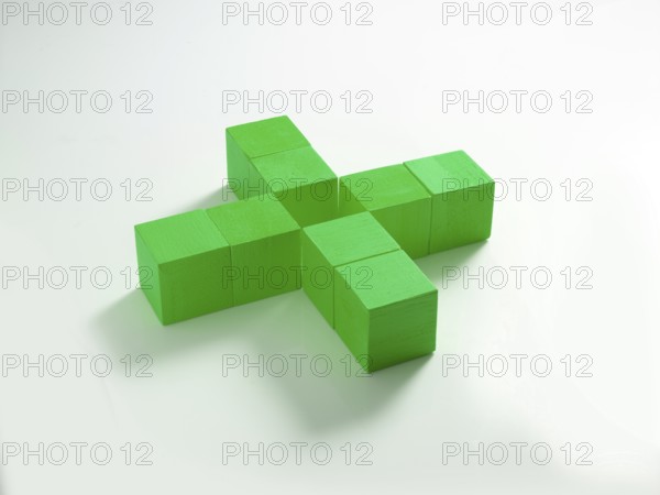 8 green wooden cubes against a white background