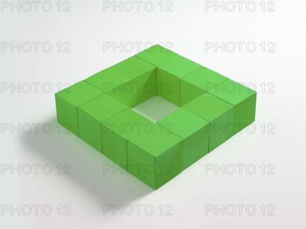 12 green wooden cubes against a white background