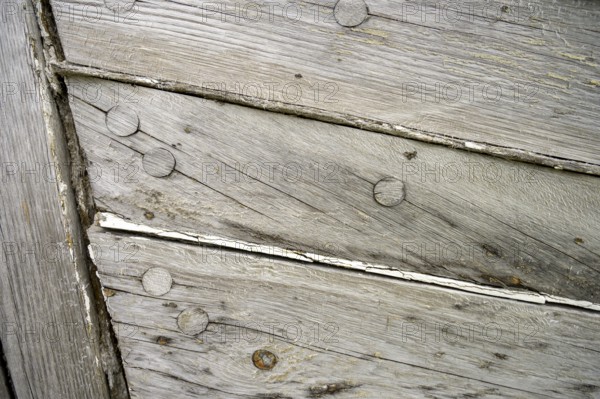 Close-up of weathered wooden planks of an old fishing boat, Vestre Jacobselv, Finnmark, Norway