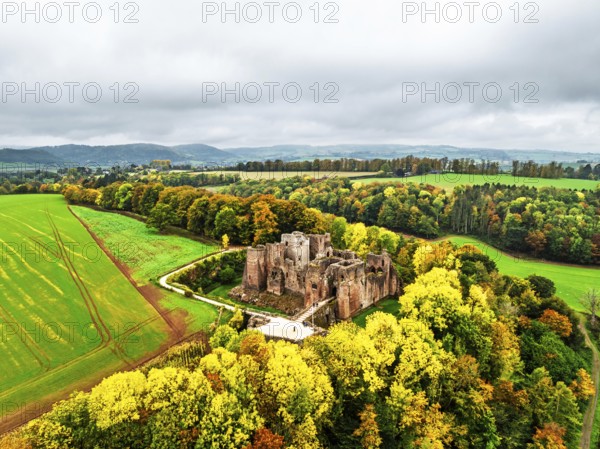 Autumn Colours over ruins of Goodrich Castle and River Wye from a drone, Goodrich, Herefordshire, England, United Kingdom