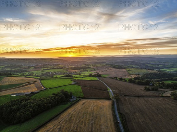 Sunset of Devon Farms and Fields over Berry Pomeroy from a drone, Totnes, England, United Kingdom