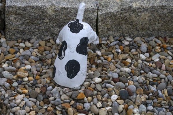 Dog figure with head in a stone bed, Franconia, Bavaria, Germany