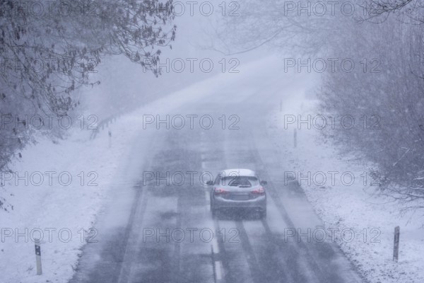 Country road in Elfringhauser Switzerland, near Sprockhövel, snowfall, snowy, North Rhine-Westphalia, Germany