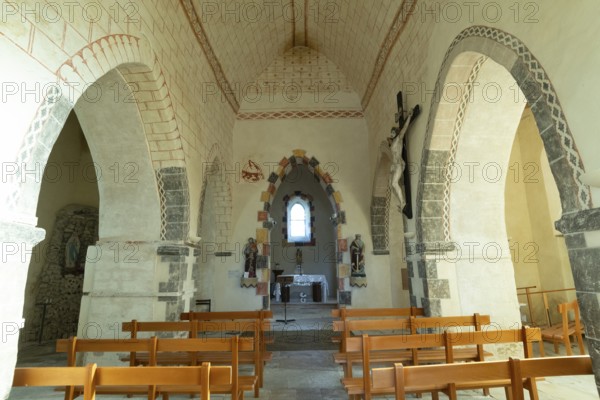Painted church St Aignan's Church of Begues. Central nave flanked by two aisles. Allier department. Auvergne Rhone Alpes. France. Europe