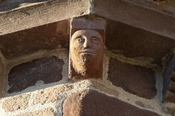 Azerat village. Sculpture of Roman church Saint-Jean-Baptiste . Haute Loire. Auvergne Rhone Alpes. France