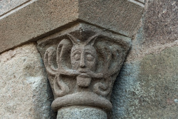 Sculptural details on the porch of the Romanesque church in Azerat village, Haute Loire, Auvergne-Rhone-Alpes, France