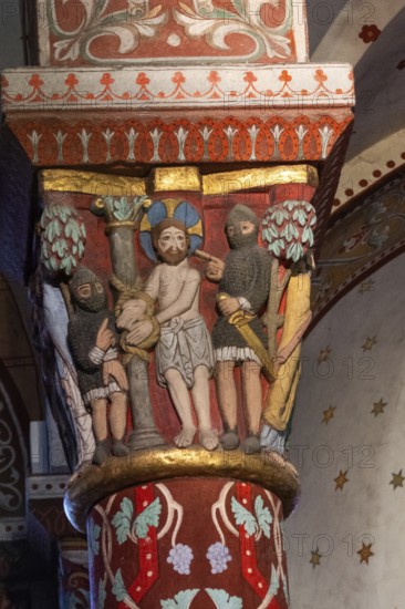 Issoire. Pillar (Jesus is tied to a column by two soldiers, to be flogged) . Saint-Austremoine Roman chuch, Auvergne Rhone Alpes, France