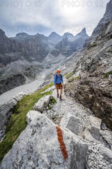 Mountaineers on a hiking trail with red trail markings, rocky mountain landscape, Via Ferrata SOSAT via ferrata, Brenta Mountains, Trentino, Italy
