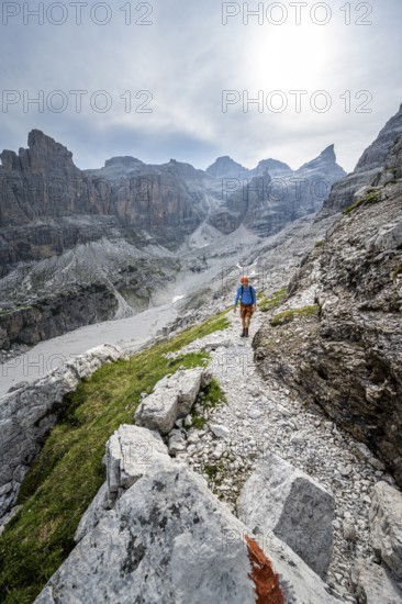Climbers on a hiking trail, rocky mountain landscape, Via Ferrata SOSAT via ferrata, Brenta Mountains, Trentino, Italy