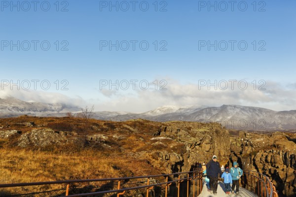 Walkers, tourists on hiking trail, Þingvellir National Park, impressive Almannagja Gorge, Allmännerschlucht, Golden Circle, Mid-Atlantic Ridge, Iceland
