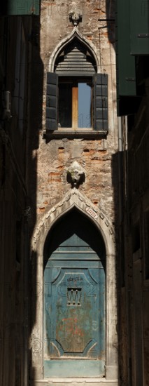 Old entrance gate at the end of Calle Mezzo, Sestiere Castello, Venice, Veneto, Italy