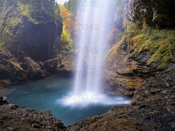Waterfall mountain list in autumn-colored surroundings, Linthal, Klausenpass, Canton of Glarus, Switzerland