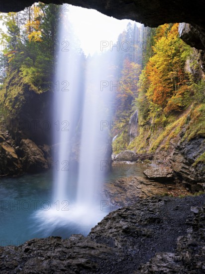 Waterfall mountain list in autumn-colored surroundings, Linthal, Klausenpass, Canton of Glarus, Switzerland