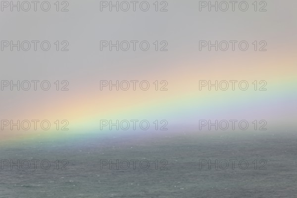 Tallow Beach bay with rainbow, lookout Byron Bay lighthouse, New South Wales, Australia