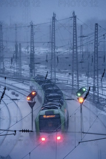 Winter weather, snowfall, S-Bahn train, regional traffic, on the route east, in front of Essen main station, regional transport North Rhine-Westphalia, Germany