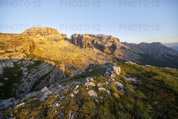 View of rocky mountain peaks of the Brenta Mountains at sunset, Alpenglühen, mountain landscape on the Grosté Plateau, Brenta, Parco Naturale Brenta-Adamello, Trentino, Italy