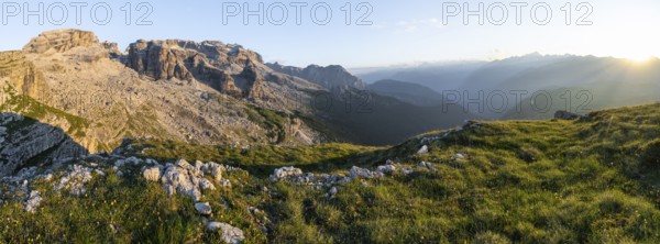 Panorama, view of rocky mountain peaks of the Brenta Mountains in the evening light, sunset over the Adamello Group, mountain landscape on the Grosté Plateau, Brenta-Adamello Natural Park, Trentino, Italy