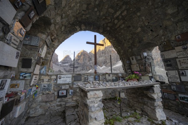 Cappella Ai Brentei chapel Memorial for injured mountaineers at the Rifugio Ai Brentei mountain hut, rocky peaks at sunrise with alpine glow, picturesque mountain landscape, Brenta, Trentino, Italy