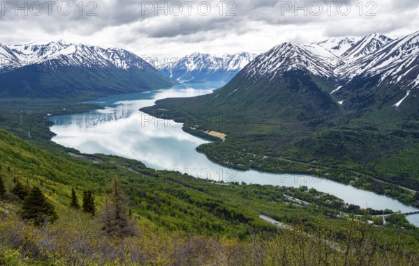 View of snowy mountains and turquoise lake Kenai Lake, Slaughter Ridge Trail, Cooper Landing, Kenai Peninsula, Alaska, USA