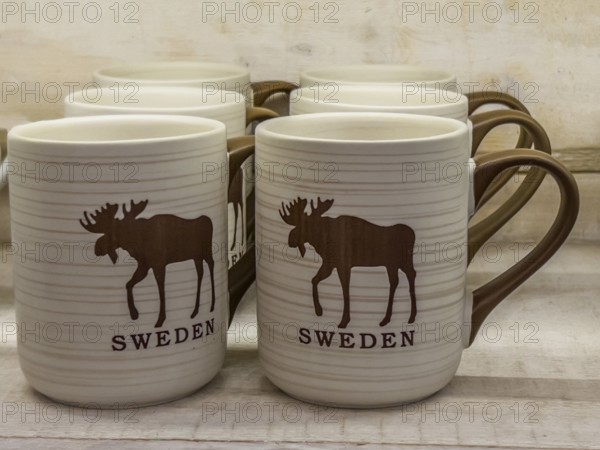 Swedish souvenir: mugs with moose picture in Småland Moose park in Markaryd, Småland County, Sweden, Scandinavia