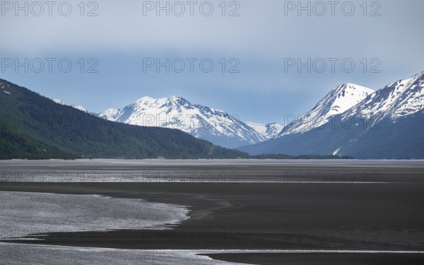 View of the Turnagain Arm estuary at low tide to the mountains of the Kenai Peninsula, Anchorage, Alaska, USA