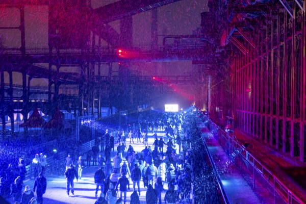 Ice rink at the Zollverein coking plant, ice skating with music and many lighting effects, Essen, North Rhine-Westphalia, Germany